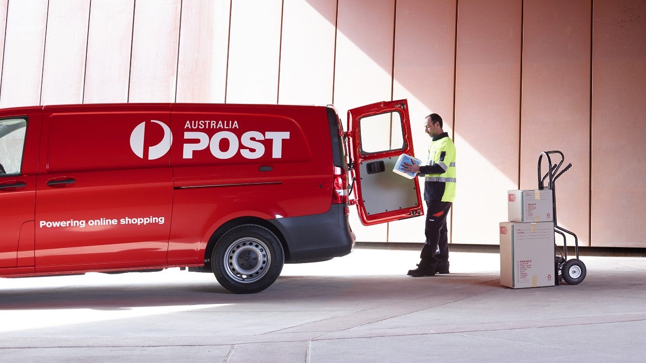 Postie unloading a van