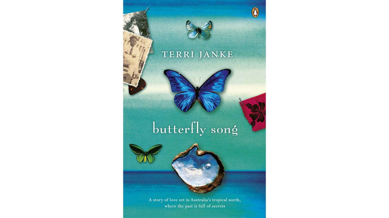 The image features the cover of the book 'Butterfly Song' by Terri Janke. The design showcases several butterflies, including a prominent blue butterfly at the center, set against a gradient blue background. Additional visuals include a shell, old photographs, and a small green butterfly. The text includes the author's name, book title, and a tagline about a story set in Australia's tropical north.